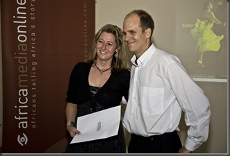 South African photographer based in Johannesburg, Toni Jade Efune, receives the 2008 Microsoft Woman Photo Entrepreneur of the Year Award from David Larsen, Managing Director of Africa Media Online at the award ceremony in Pietermaritzburg, South Africa. The award, sponsored by Microsoft's Pro Photo Community is part of the African Photo Entrepreneur Programme run by Africa Media Online. Close to 150 professional and semi professional photographers from all over Africa applied to be admitted to the programme of which 40 were selected to participate in the Digital Campus which saw UK based digital imaging consultant, Graeme Cookson, and Microsoft Icons of Imaging member, Peter Krogh, teaching participants in digital workflow using Microsoft's Expression Media 2.0. Microsoft also donated a copy of Expression Media 2.0 to each of the participants who had to undertake an assignment to produce photography which reflects the reality of Africa not often seen in the international media - proud, stylsh, technologically savvy Africans. Twenty-seven photographers got the approval from an international panel of judges including Pulitzer prize-winning photographer, Greg Marinovich, Microsoft Icons of Imaging Member, Peter Krogh, Getty Images multimedia photojournalist, Rick Gershon, picture editor for The Image Works photo agency in Woodstock, NY, Katherine van Acker, and veteran photographer, Leonie Marinovich. The 27 photographers were invited on the Global Competitiveness Masterclass where participants were given input in becoming globally competitive from leaders in the photography business from Africa, Europe and the US including Nic Haralambous, director of zoopy.com, South African based Rosanne Larsen of africanpictures.net and Dominique Le Roux of Moonshine Media, Bill Creighton, CEO of Newscom in the USA, Ali Paczensky and Agnes Folaji of Fotofinder in Germany, Rick Gershon multimedia photojournalist at Getty Images in New York, Katherine van Acker of The Image Works in Woodstock, NY, South African Pulitzer Prize-winning photographer Greg Marinovich and his wife Leonie, US based stock photographer, Jack Hollingsworth and Africa Media Online's managing director David Larsen. The award winners were selected by the judging panel from the 27 finalists.