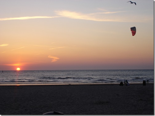 a sunset on the water at The Hauge